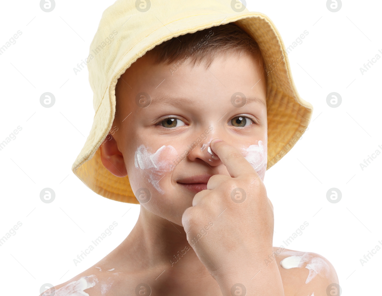 Little boy applying sun protection cream onto his skin on white background Photo of Little boy applying sun protection cream onto his skin on white background