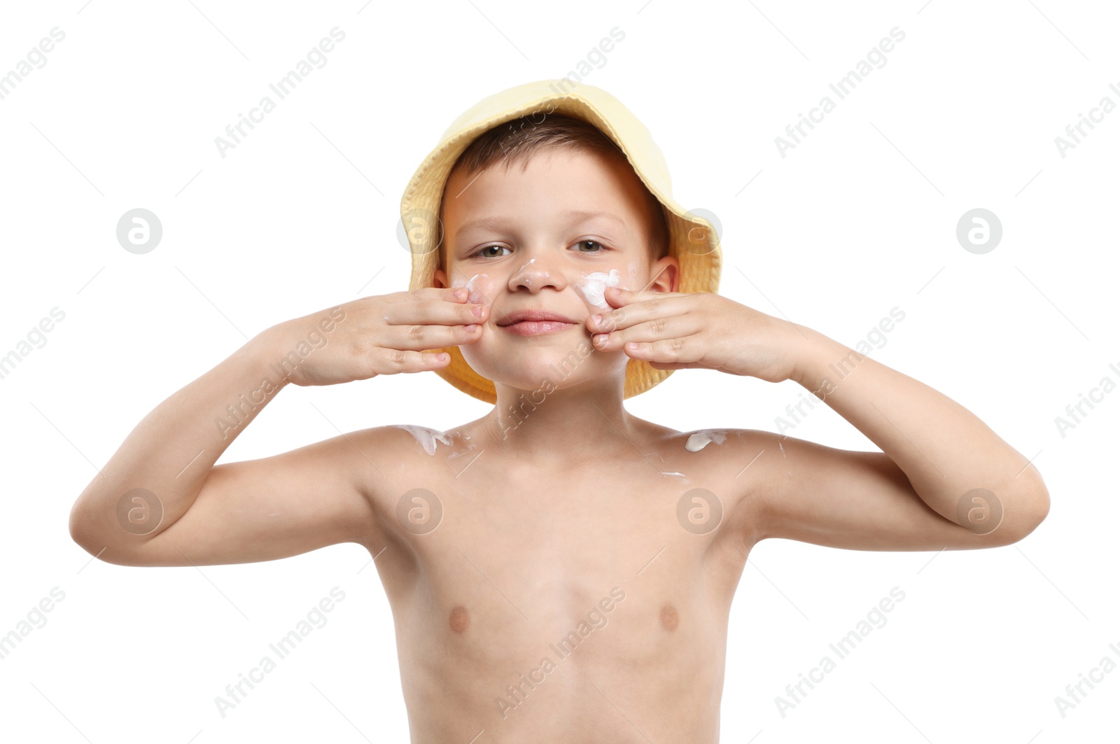 Photo of Little boy applying sun protection cream onto his skin on white background