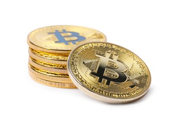 Photo of Cryptocurrency. Many golden bitcoins isolated on white