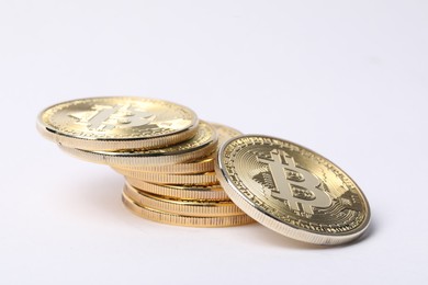 Photo of Cryptocurrency. Many golden bitcoins on white background