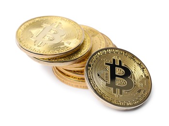 Photo of Cryptocurrency. Many golden bitcoins isolated on white