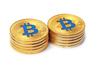 Photo of Cryptocurrency. Many golden bitcoins isolated on white
