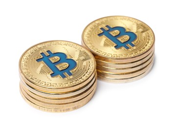 Photo of Cryptocurrency. Many golden bitcoins isolated on white