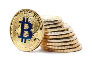 Photo of Cryptocurrency. Many golden bitcoins isolated on white