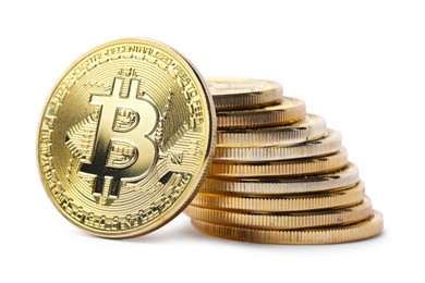 Photo of Cryptocurrency. Many golden bitcoins isolated on white