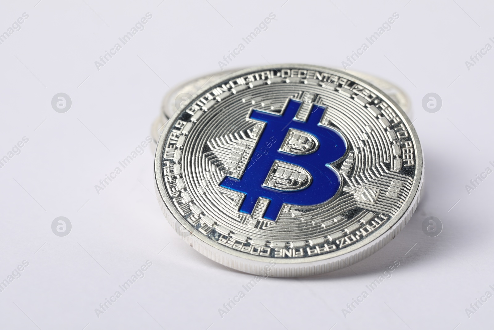 Cryptocurrency. Many silver bitcoins on white background, closeup Photo of Cryptocurrency. Many silver bitcoins on white background, closeup