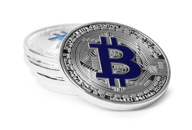 Photo of Cryptocurrency. Many silver bitcoins isolated on white