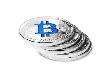 Photo of Cryptocurrency. Many silver bitcoins isolated on white