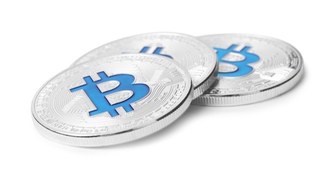 Photo of Cryptocurrency. Many silver bitcoins isolated on white