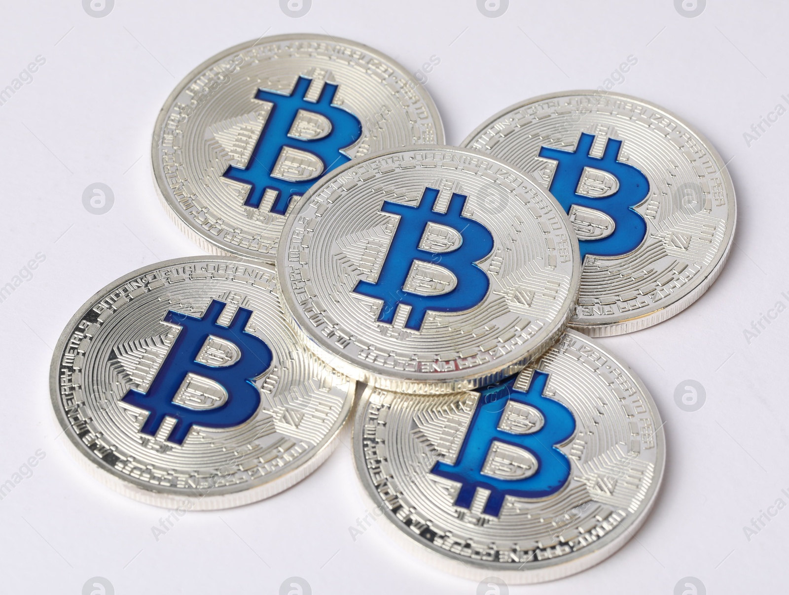 Cryptocurrency. Many silver bitcoins on white background, closeup Photo of Cryptocurrency. Many silver bitcoins on white background, closeup