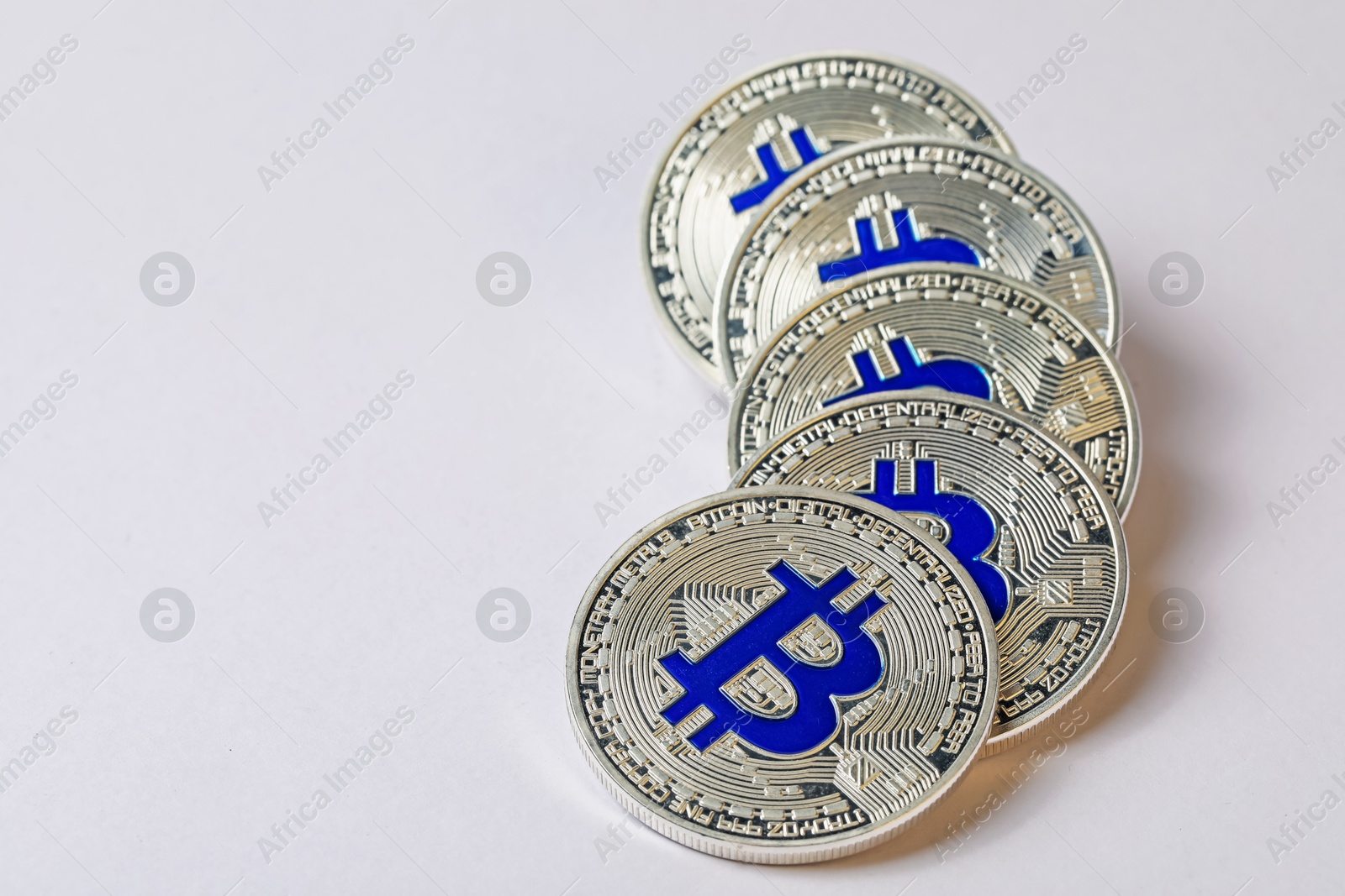 Cryptocurrency. Many silver bitcoins on light background, closeup. Space for text Photo of Cryptocurrency. Many silver bitcoins on light background, closeup. Space for text
