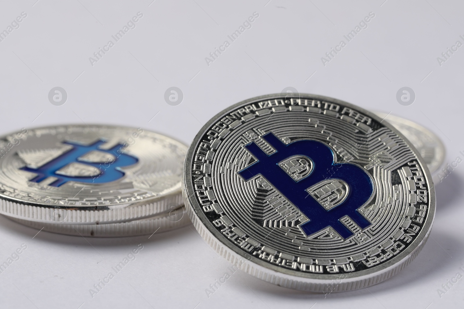 Cryptocurrency. Many silver bitcoins on light background, closeup Photo of Cryptocurrency. Many silver bitcoins on light background, closeup