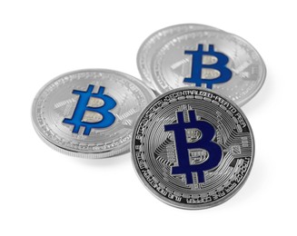 Photo of Cryptocurrency. Many silver bitcoins isolated on white