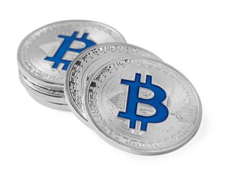Photo of Cryptocurrency. Many silver bitcoins isolated on white