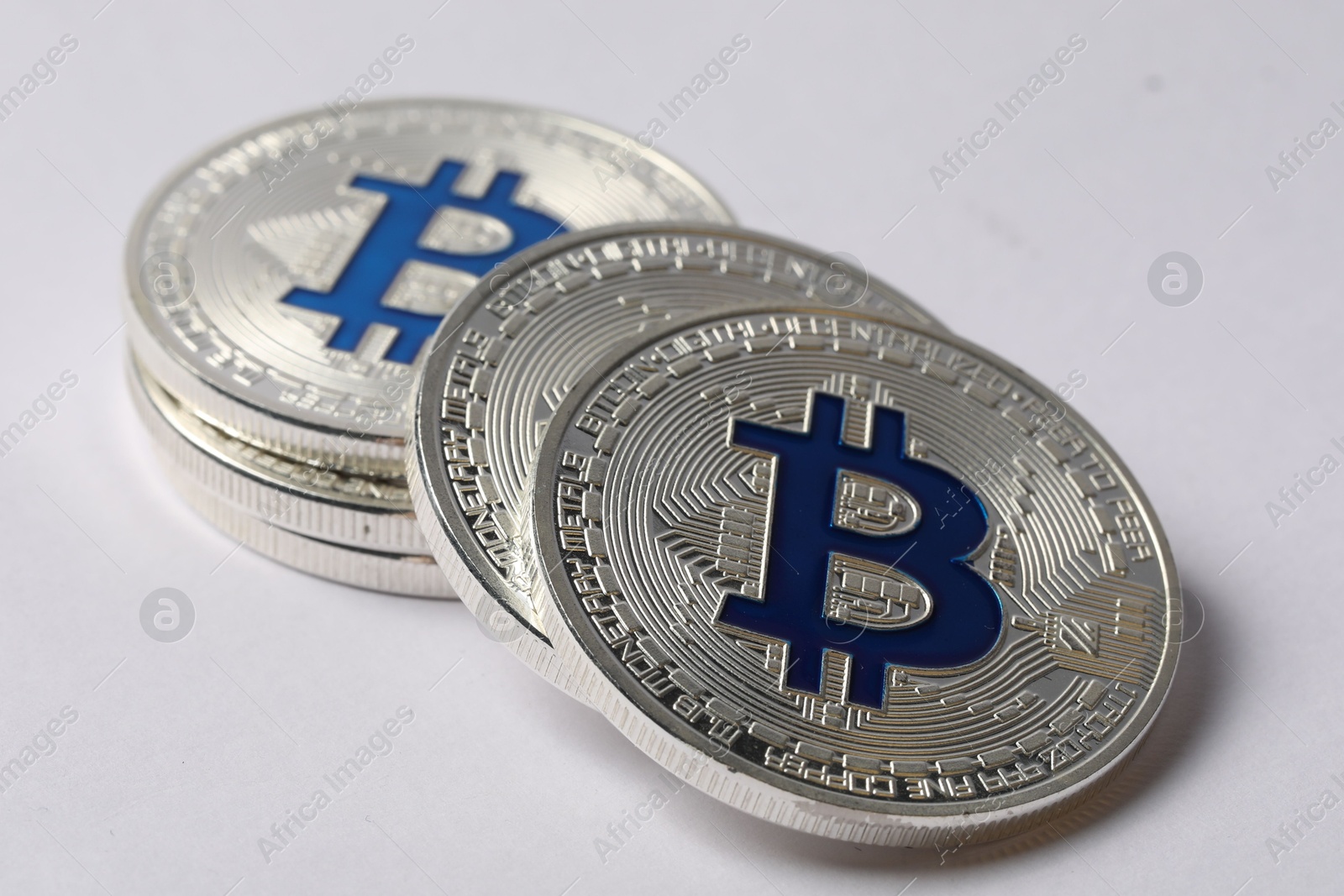 Cryptocurrency. Many silver bitcoins on light background, closeup Photo of Cryptocurrency. Many silver bitcoins on light background, closeup