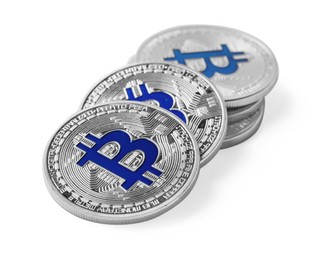 Photo of Cryptocurrency. Many silver bitcoins isolated on white