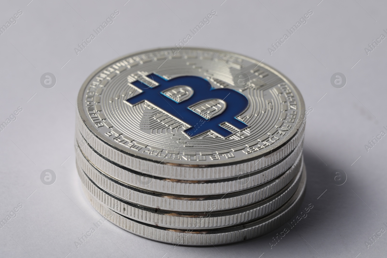 Cryptocurrency. Many silver bitcoins on light background, closeup Photo of Cryptocurrency. Many silver bitcoins on light background, closeup