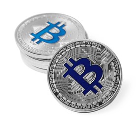 Photo of Cryptocurrency. Many silver bitcoins isolated on white