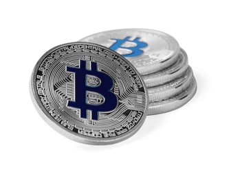 Photo of Cryptocurrency. Many silver bitcoins isolated on white