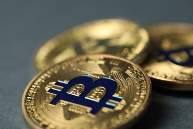 Photo of Cryptocurrency. Many bitcoins on grey background, closeup