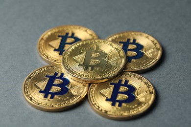 Photo of Cryptocurrency. Many bitcoins on grey background, closeup