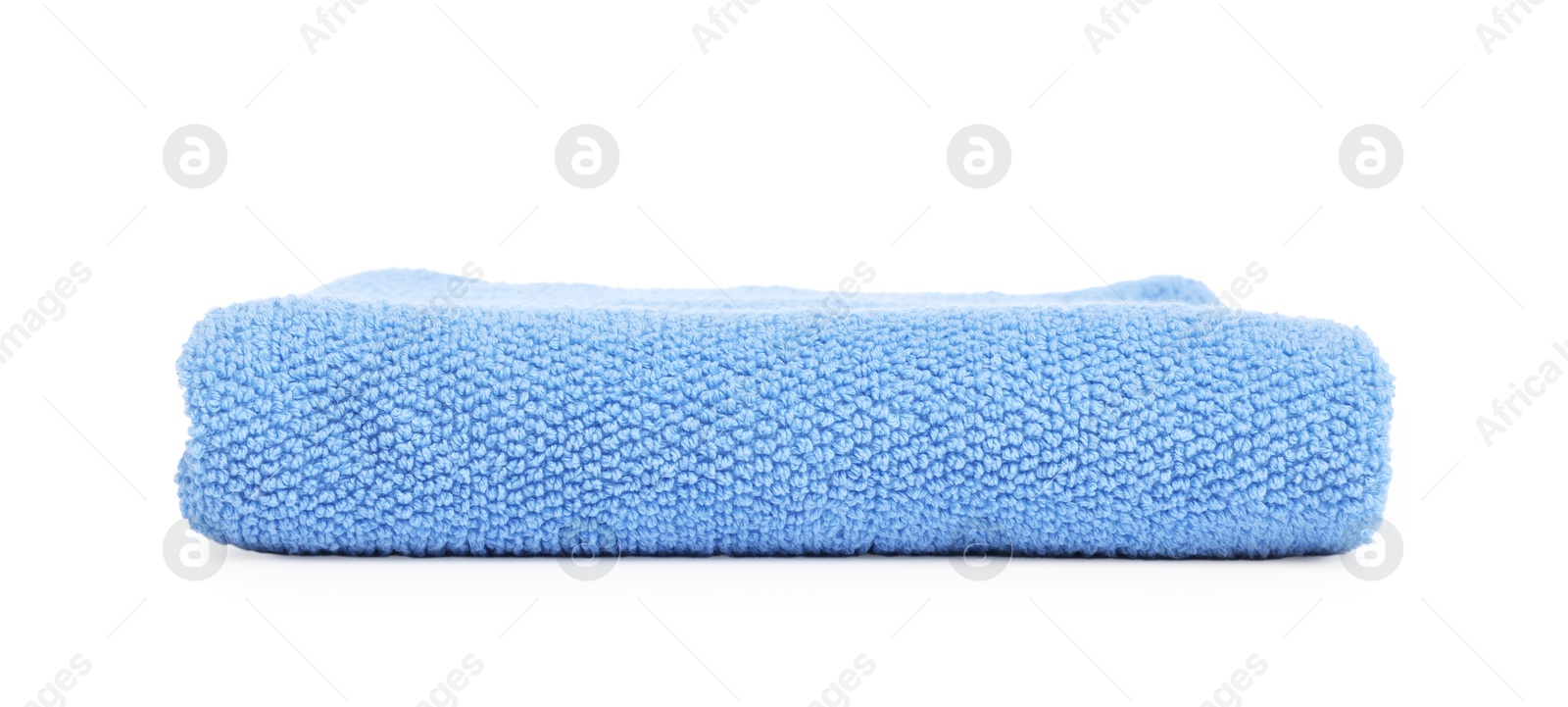 Light blue folded terry towel isolated on white Photo of Light blue folded terry towel isolated on white