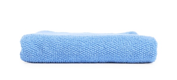 Photo of Light blue folded terry towel isolated on white