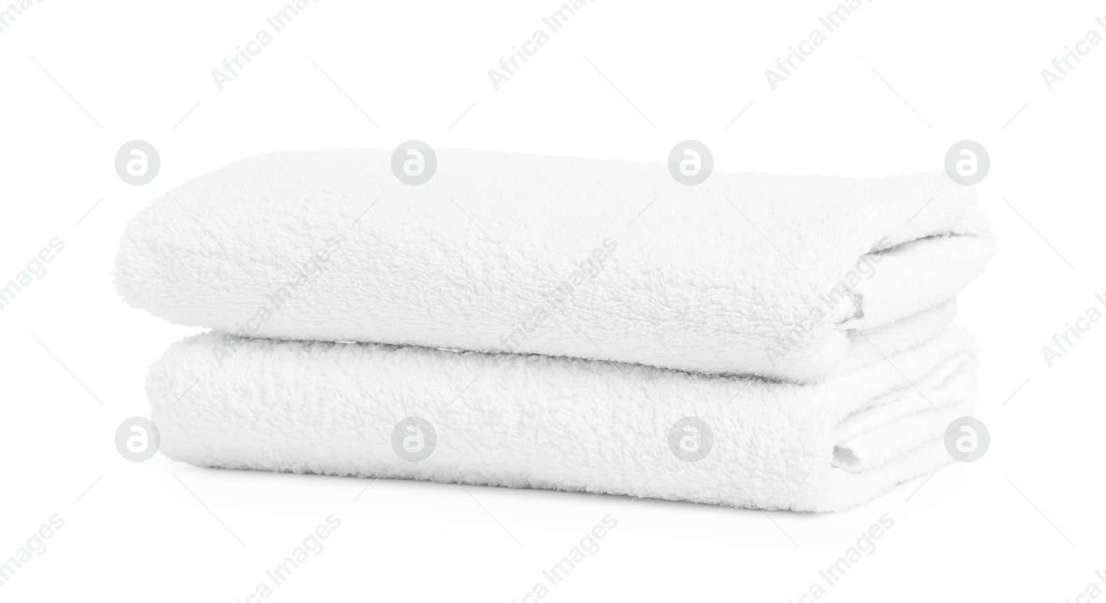 Two folded terry towels isolated on white Photo of Two folded terry towels isolated on white