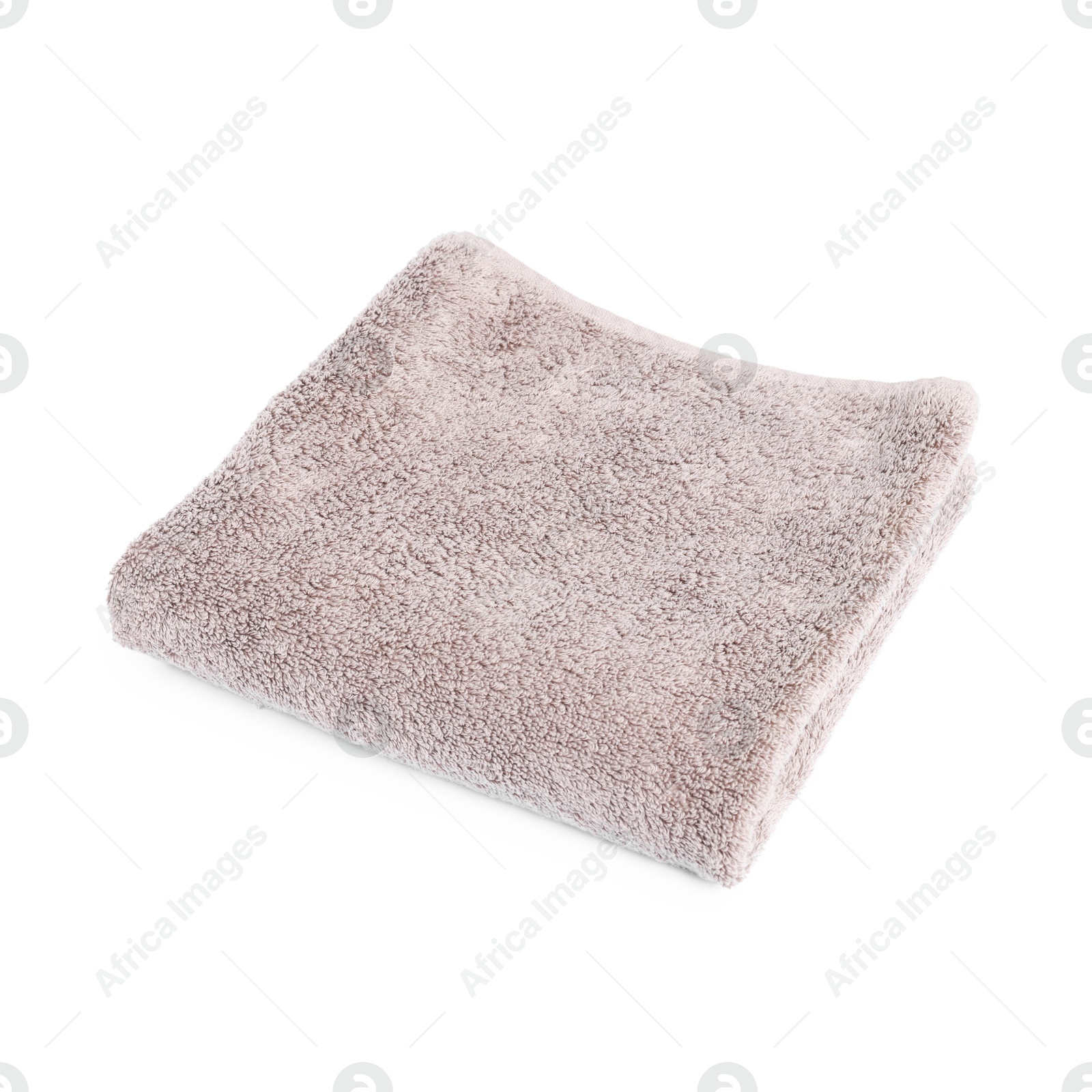 Brown folded terry towel isolated on white Photo of Brown folded terry towel isolated on white