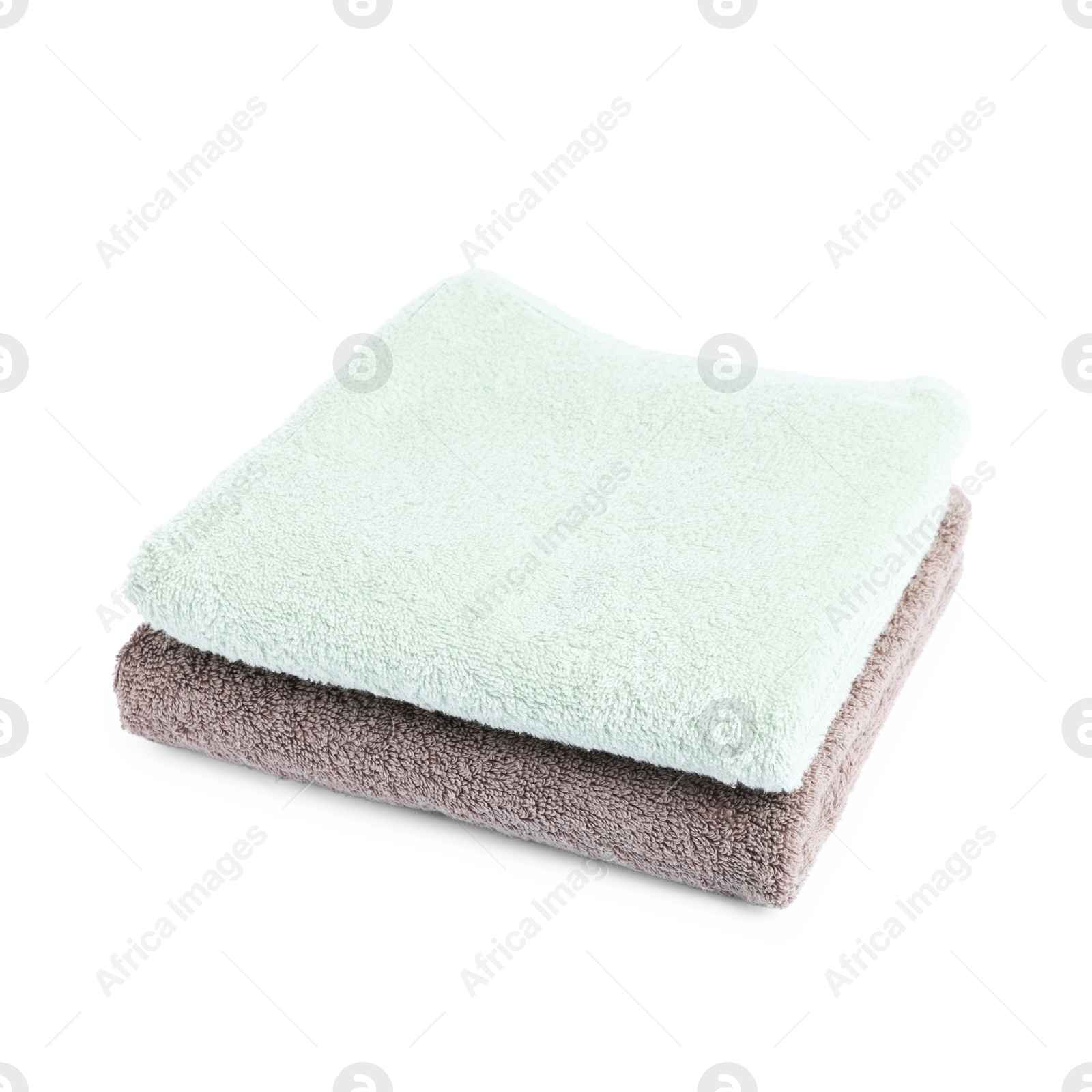 Two folded terry towels isolated on white Photo of Two folded terry towels isolated on white