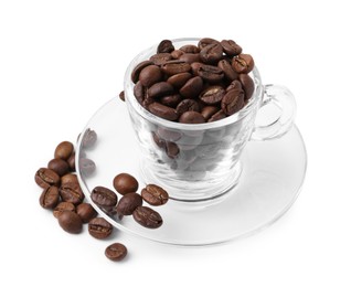 Photo of Aromatic coffee beans in cup and saucer isolated on white