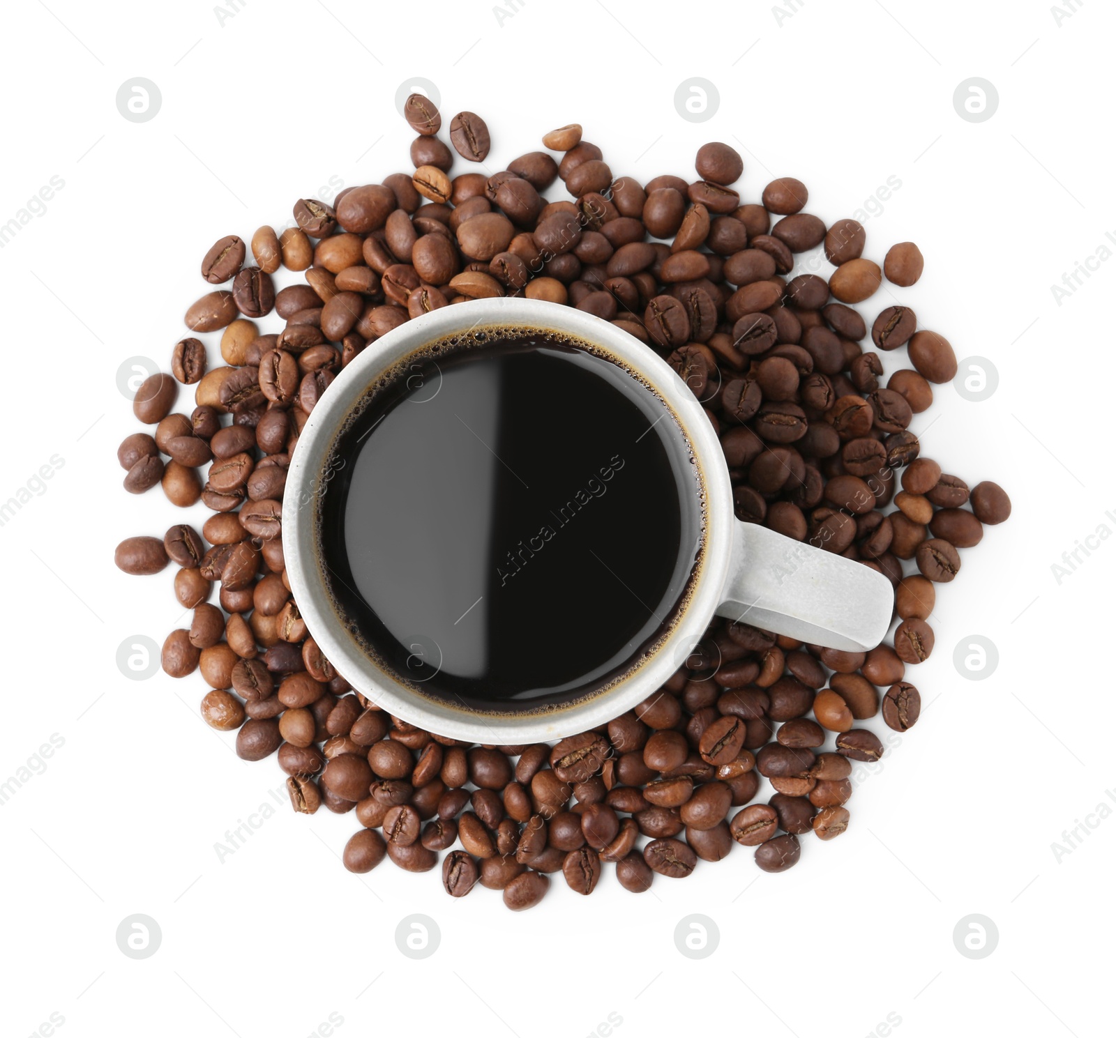 Aromatic coffee in cup and pile of beans isolated on white, top view Photo of Aromatic coffee in cup and pile of beans isolated on white, top view
