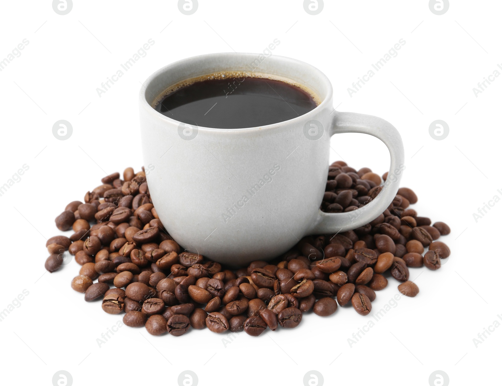 Aromatic coffee in cup and pile of beans isolated on white Photo of Aromatic coffee in cup and pile of beans isolated on white