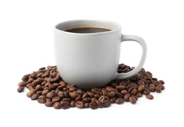 Photo of Aromatic coffee in cup and pile of beans isolated on white
