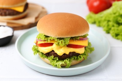 Photo of Tasty cheeseburger with lettuce and tomatoes on white table, closeup