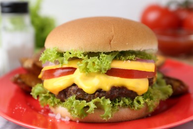 Photo of Tasty cheeseburger with lettuce and tomatoes on white table, closeup