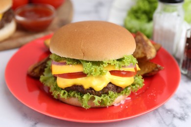 Photo of Tasty cheeseburger on white marble table, closeup