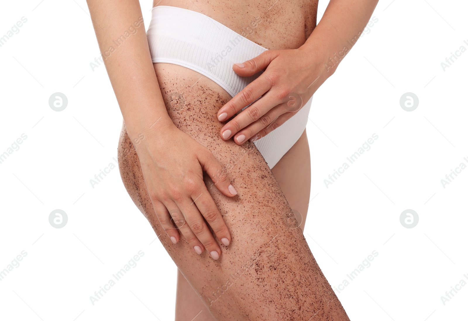 Woman with body scrub on her leg against white background, closeup Photo of Woman with body scrub on her leg against white background, closeup