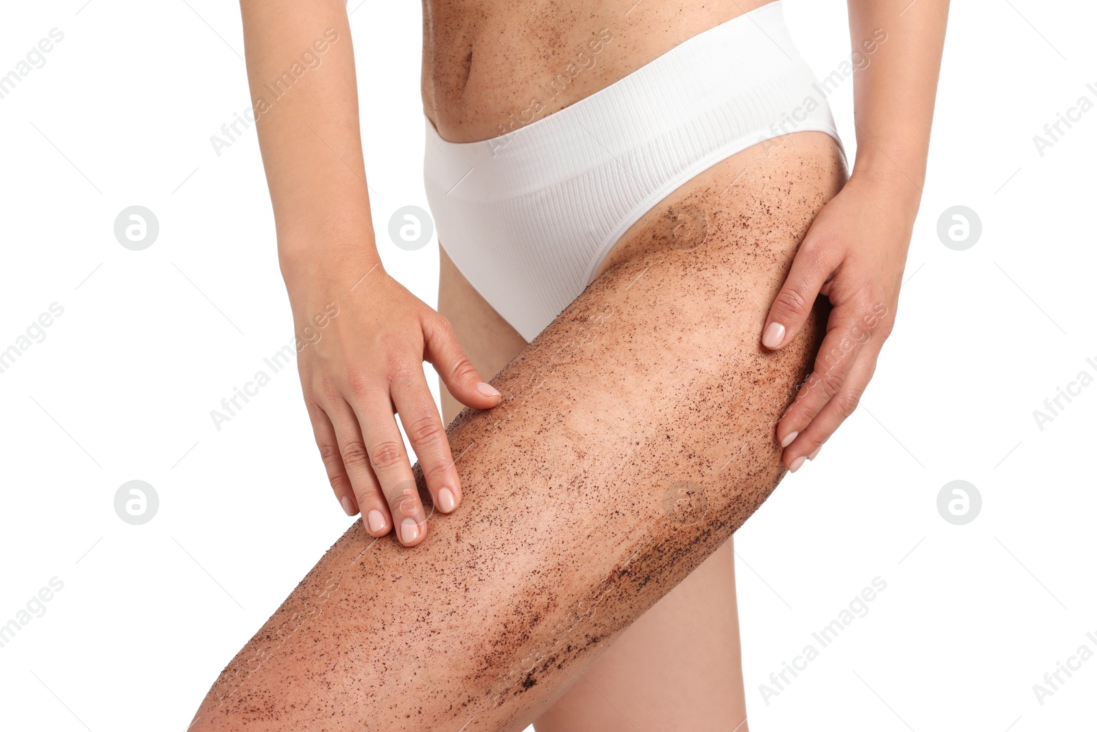 Woman with body scrub on her leg against white background, closeup Photo of Woman with body scrub on her leg against white background, closeup