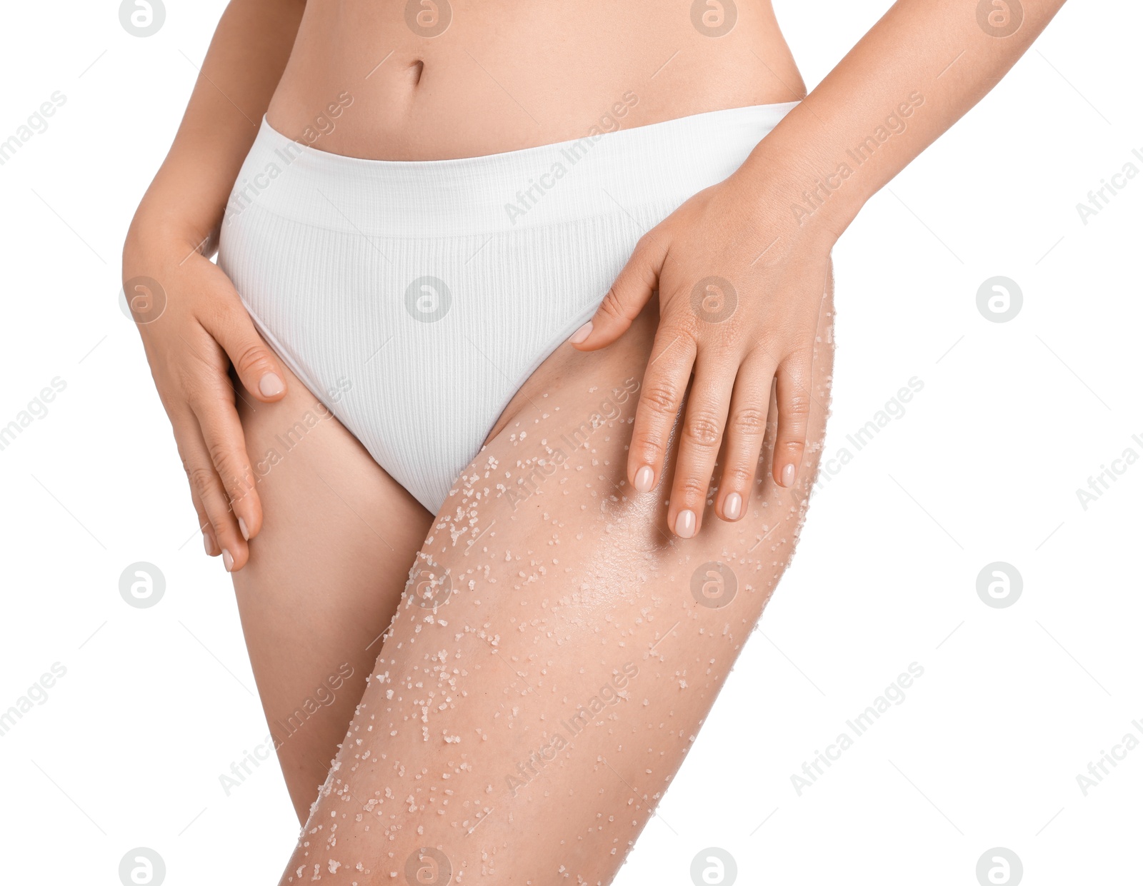 Woman with body scrub on her leg against white background, closeup Photo of Woman with body scrub on her leg against white background, closeup