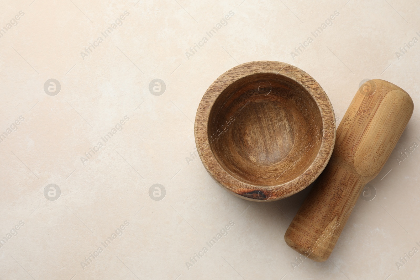 Wooden mortar and pestle on white table, top view. Space for text Photo of Wooden mortar and pestle on white table, top view. Space for text