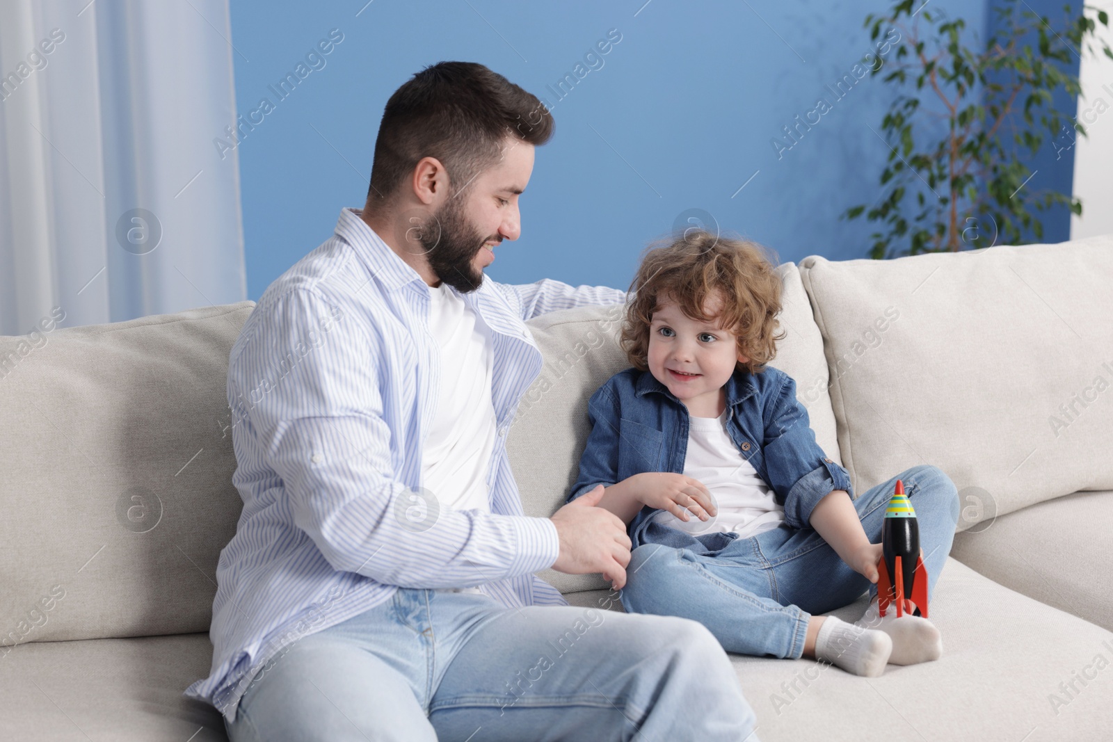 Happy father with his son playing and spending time together at home Photo of Happy father with his son playing and spending time together at home