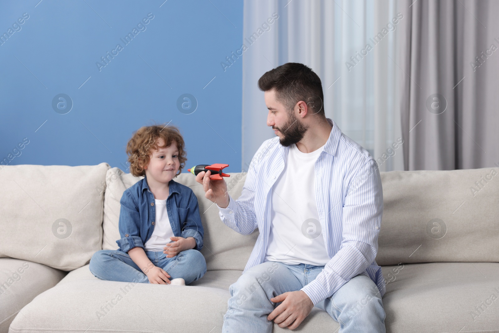 Happy father with his son playing and spending time together at home Photo of Happy father with his son playing and spending time together at home