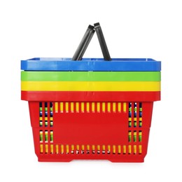Photo of Stack of colorful shopping baskets isolated on white