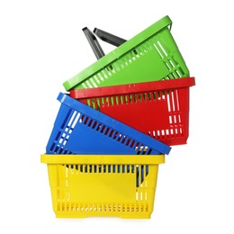 Photo of Stack of colorful shopping baskets isolated on white