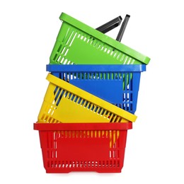 Photo of Stack of colorful shopping baskets isolated on white