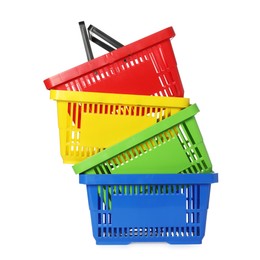 Photo of Stack of colorful shopping baskets isolated on white