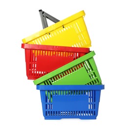 Photo of Stack of colorful shopping baskets isolated on white