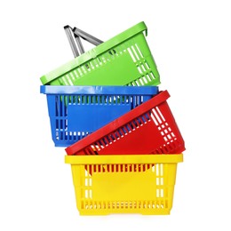 Photo of Stack of colorful shopping baskets isolated on white