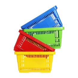 Photo of Stack of colorful shopping baskets isolated on white